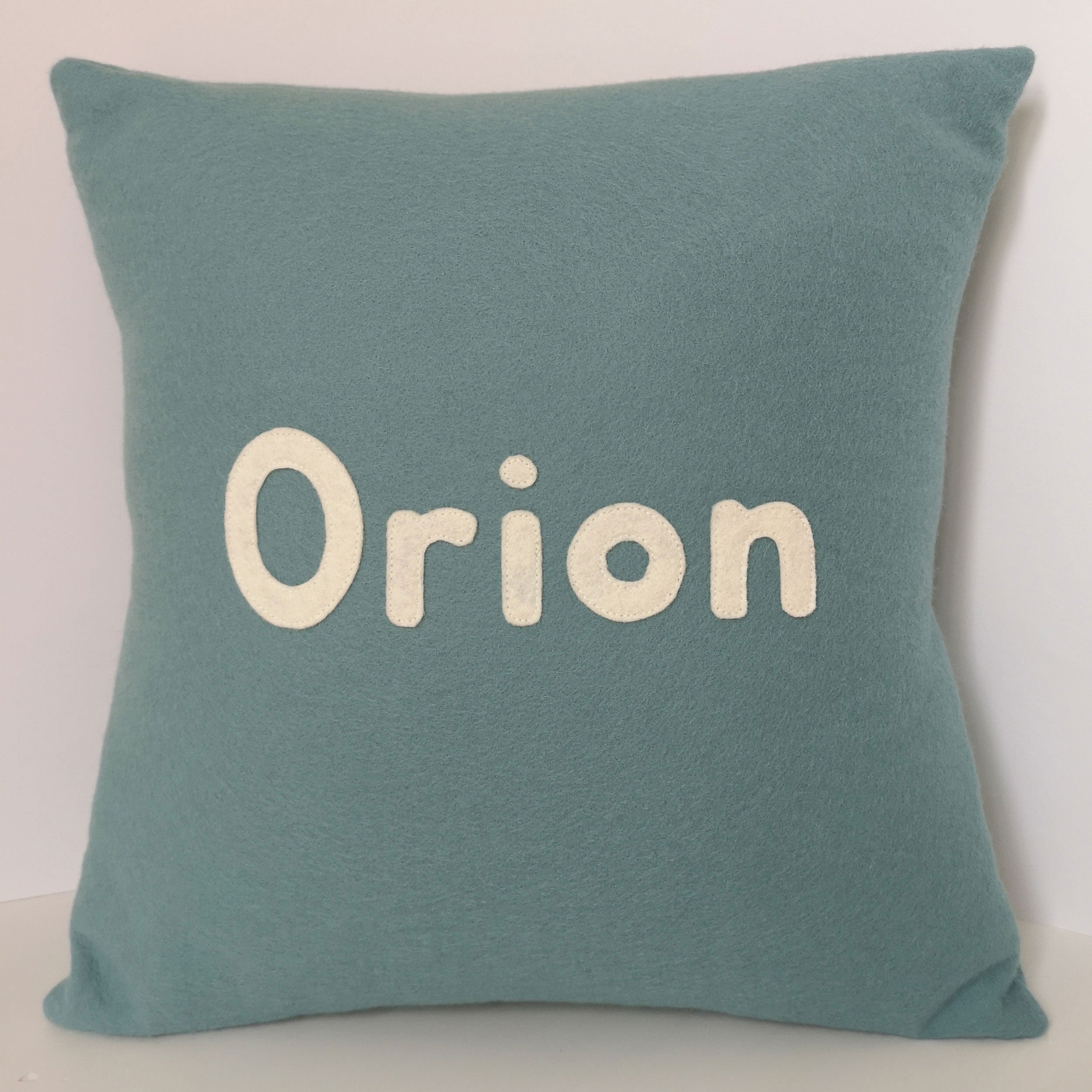 personalised name cushion in teal blue wool felt