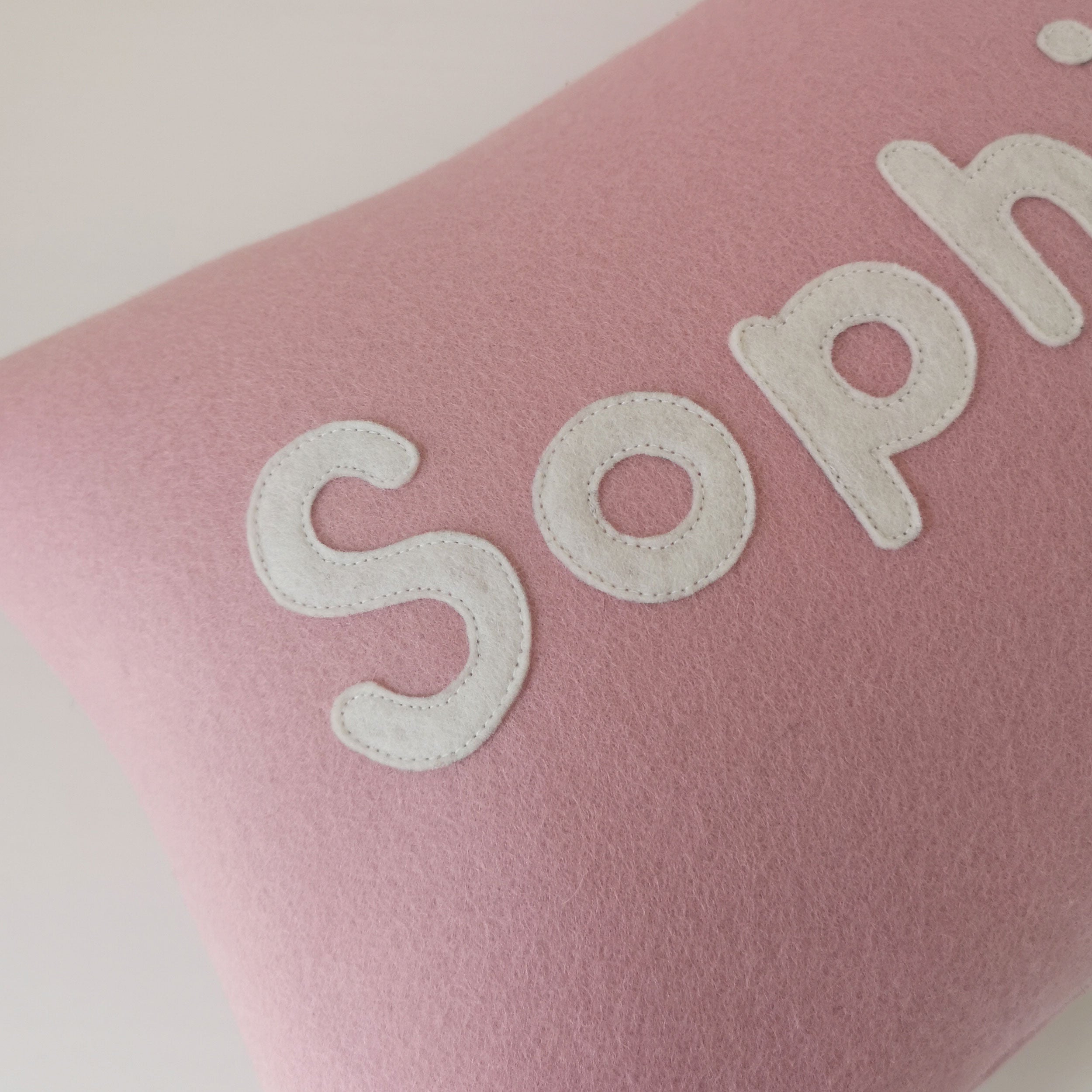 pink personalised name cushion in wool felt